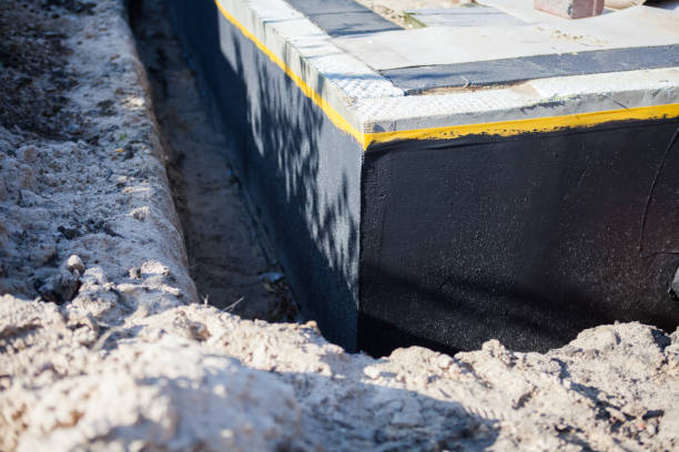Professional Basement Waterproofing technician working in Centreville, MI